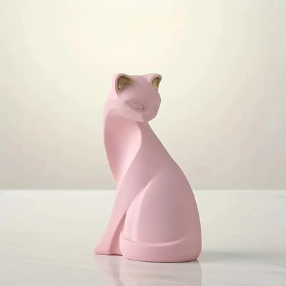 Pink cat-shaped night light on a white surface with a light pink background