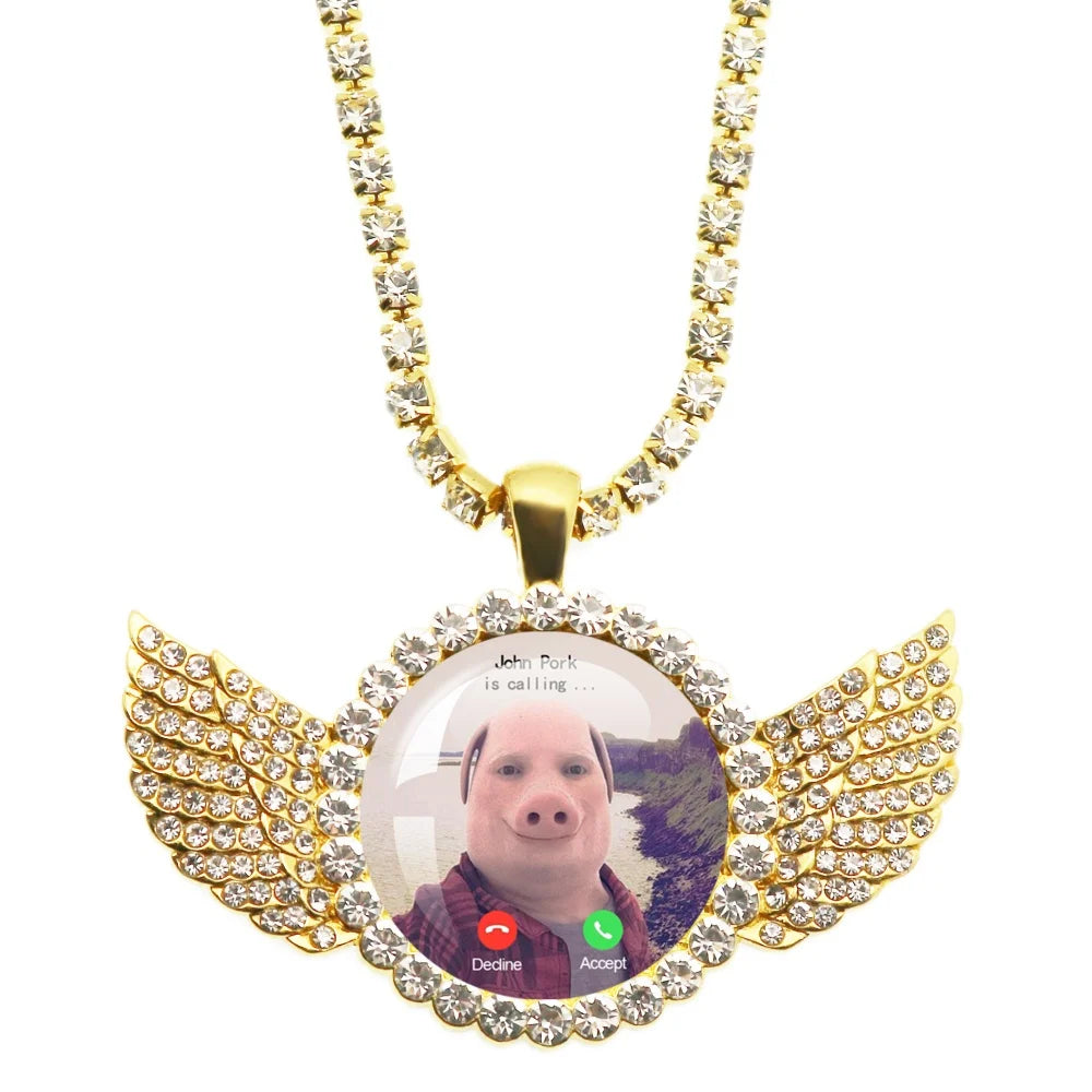 Necklace with a pendant featuring a photo of a person with wings and a gold chain.