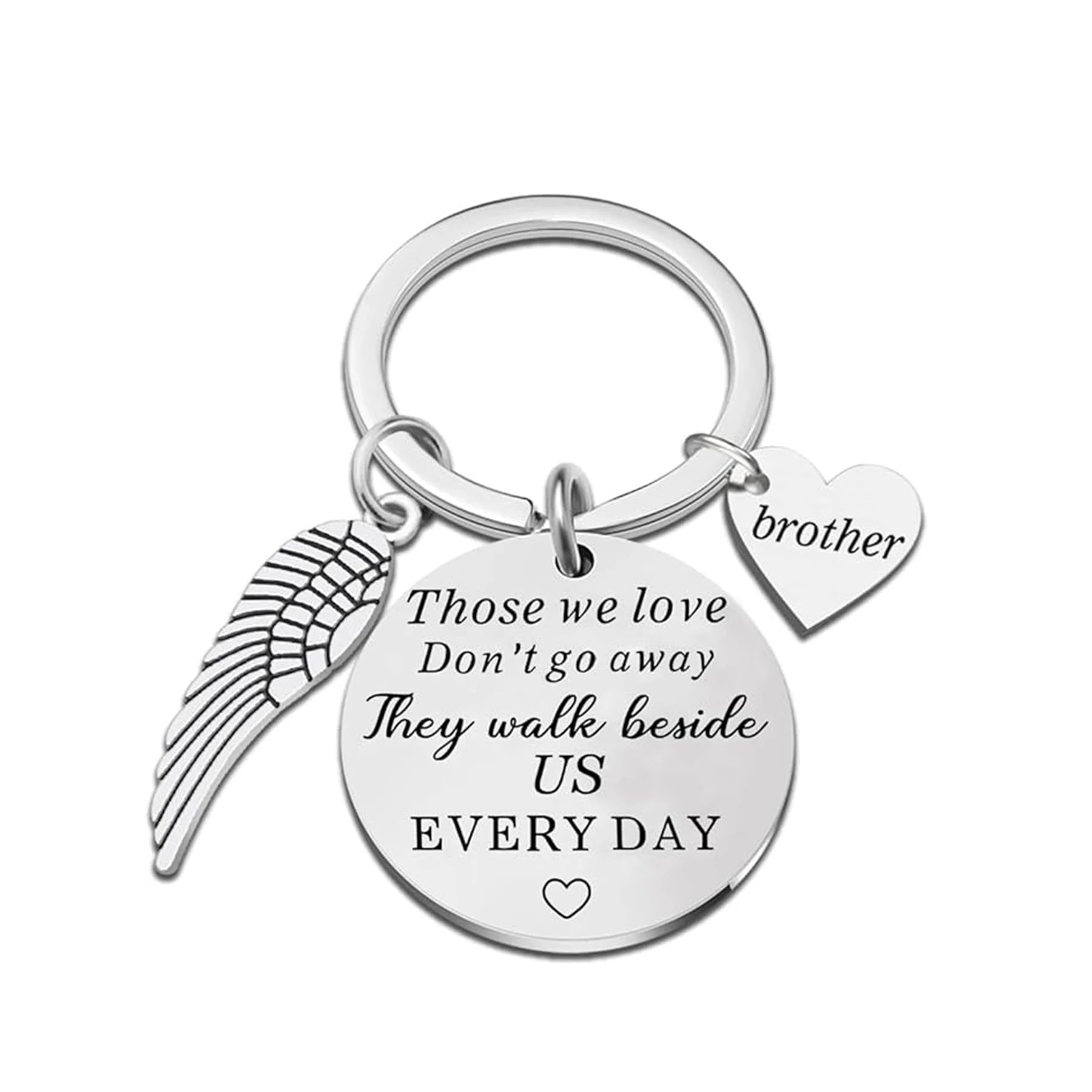 Silver keychain with angel wing, heart, and engraved message on a white background