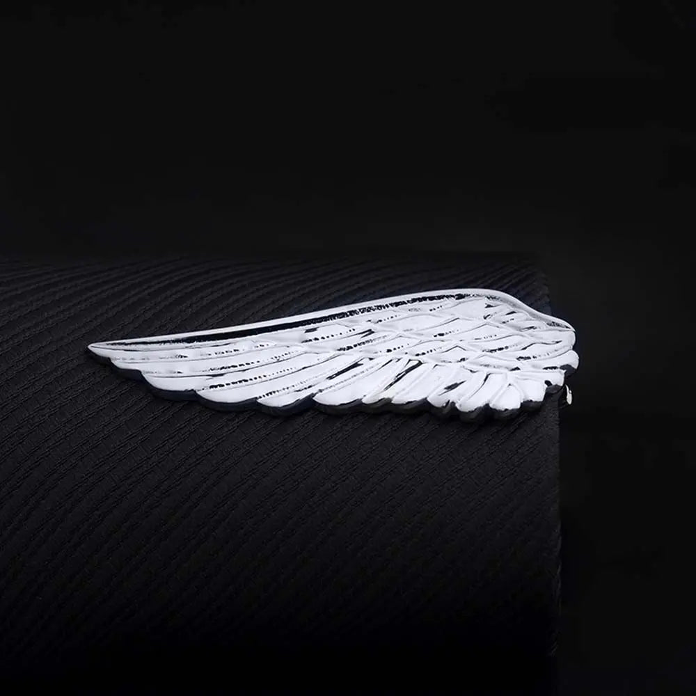 White wing-shaped object on a black background