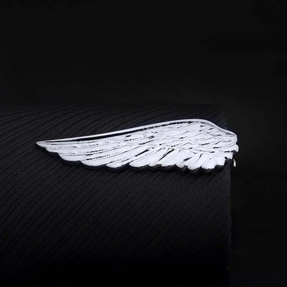 White wing-shaped object on a black background