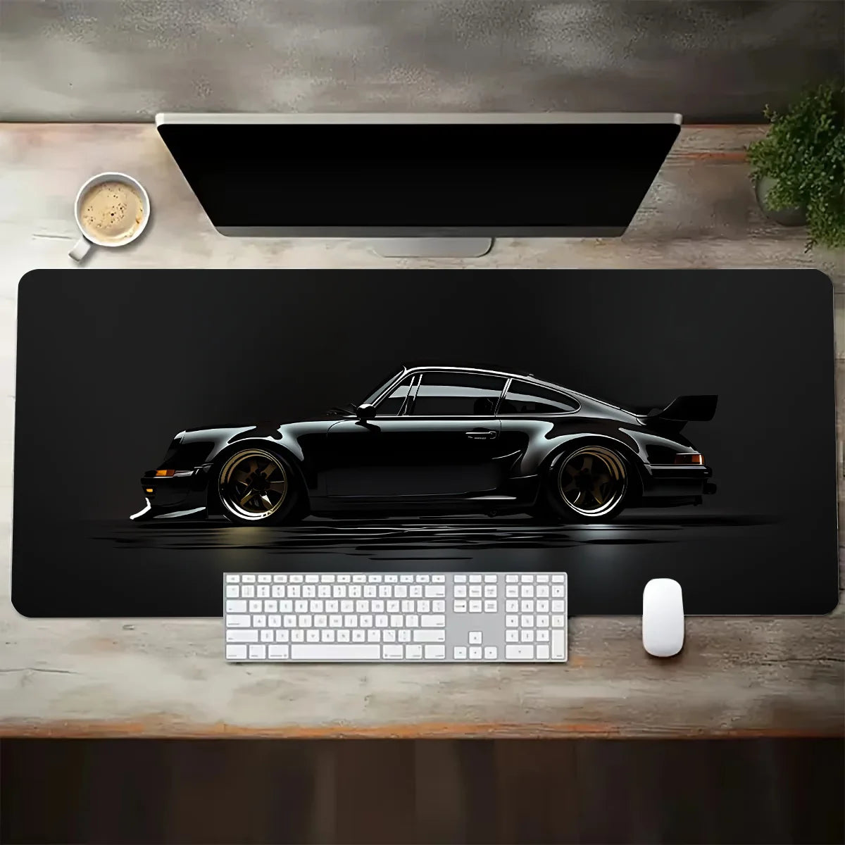 Desk setup with a large desk mat featuring a car design, keyboard, and mouse.