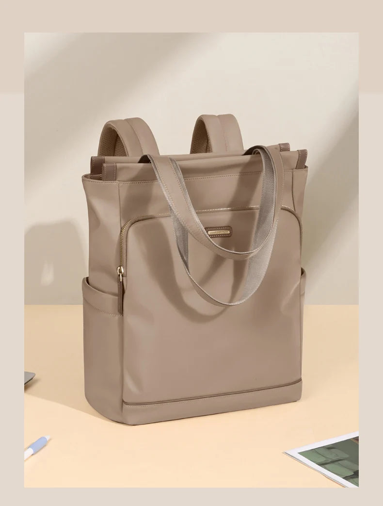 Beige tote bag with shoulder straps on a light beige background