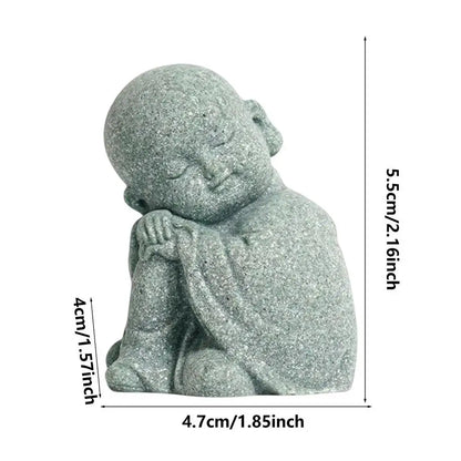 Small stone statue of a seated figure with dimensions indicated on a white background