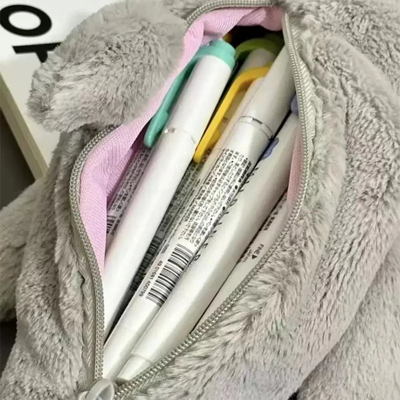Pens in a fluffy pouch with visible brand names
