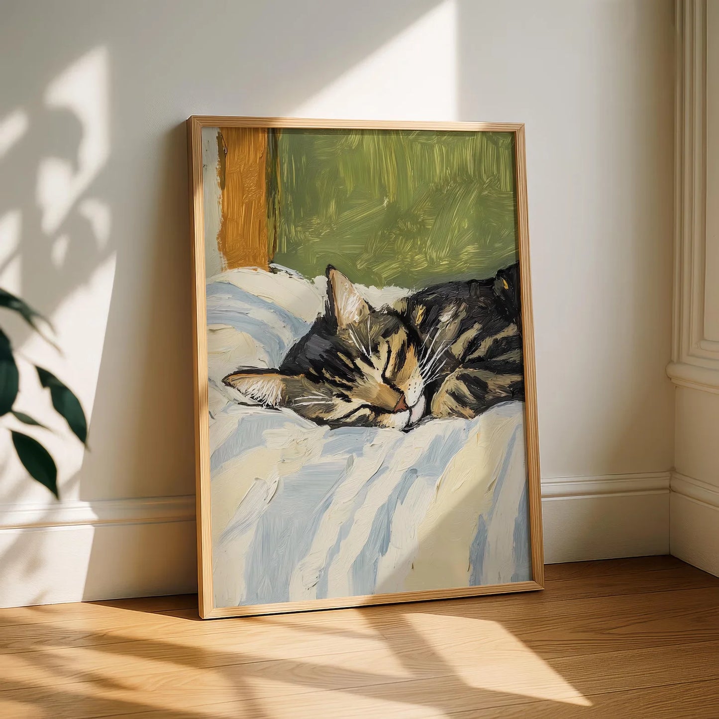 Framed painting of a cat lying on a bed in a sunlit room
