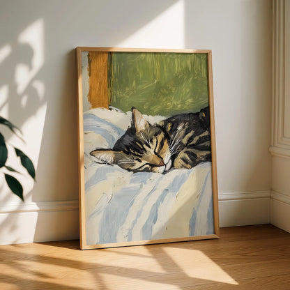 Framed painting of a cat lying on a bed in a sunlit room