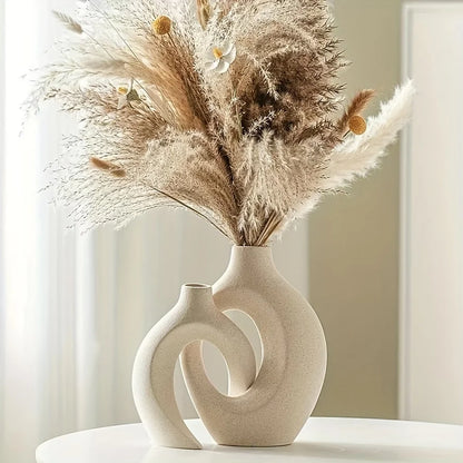 Decorative vase with dried pampas grass against a neutral background