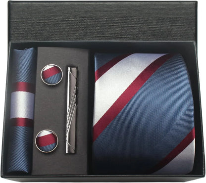 Mens accessory set with tie, pocket square, and cufflinks in a black box.
