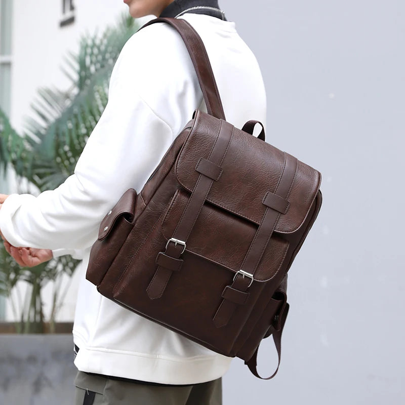 Person wearing a brown leather backpack with a blurred background