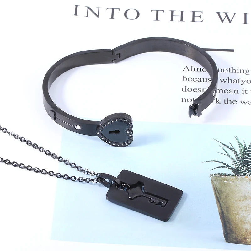 Black bracelet and key-shaped pendant on a magazine background