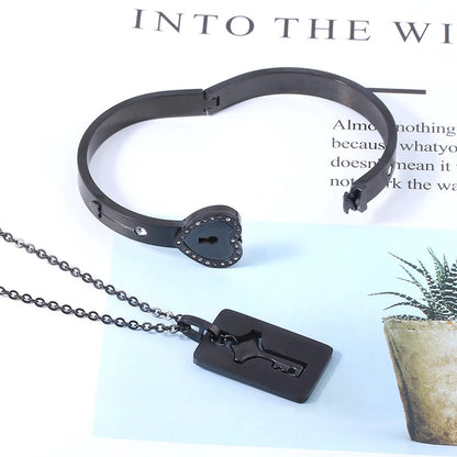 Black bracelet and key-shaped pendant on a magazine background