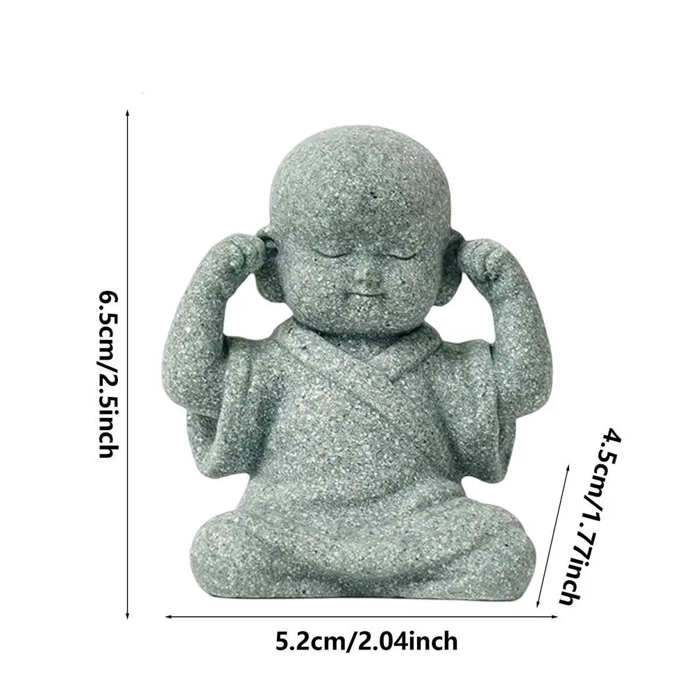 Small stone statue of a seated figure with measurements on a white background