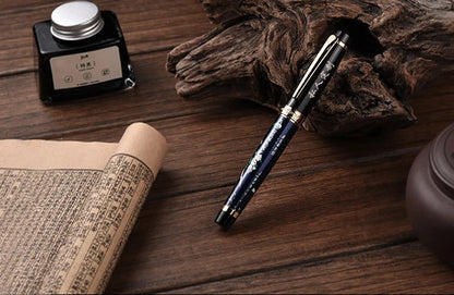 Fountain pen on a wooden surface with an ink bottle and rolled paper