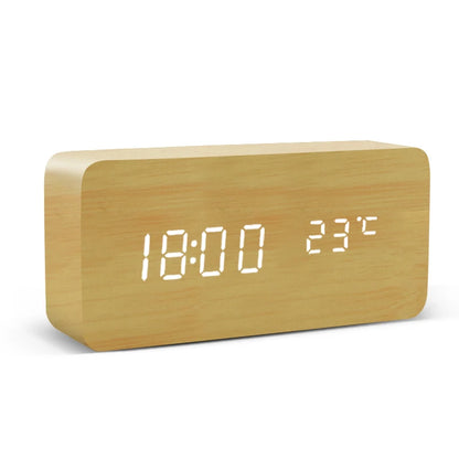 Wooden digital clock with LED display on a white background