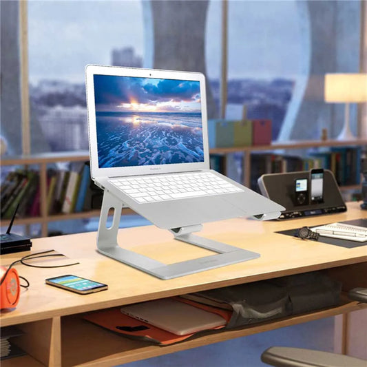 Laptop on a stand on a desk with a cityscape view