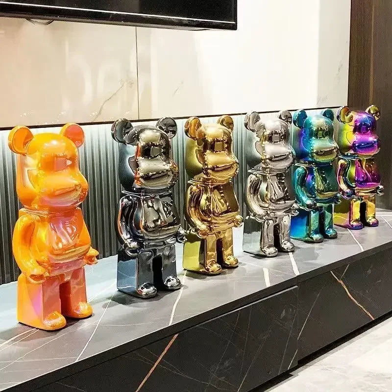 Colorful bear-shaped figurines on a reflective surface with a neutral background