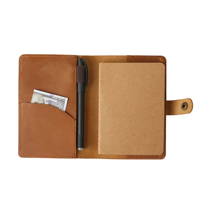 Brown leather wallet with card pocket and pen holder on a white background