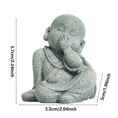 Small stone statue of a child with measurements on a white background