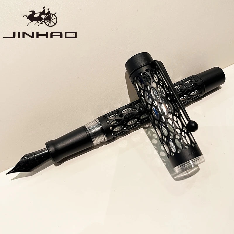 Black fountain pen with intricate design on a beige background, featuring the Jinhao brand.