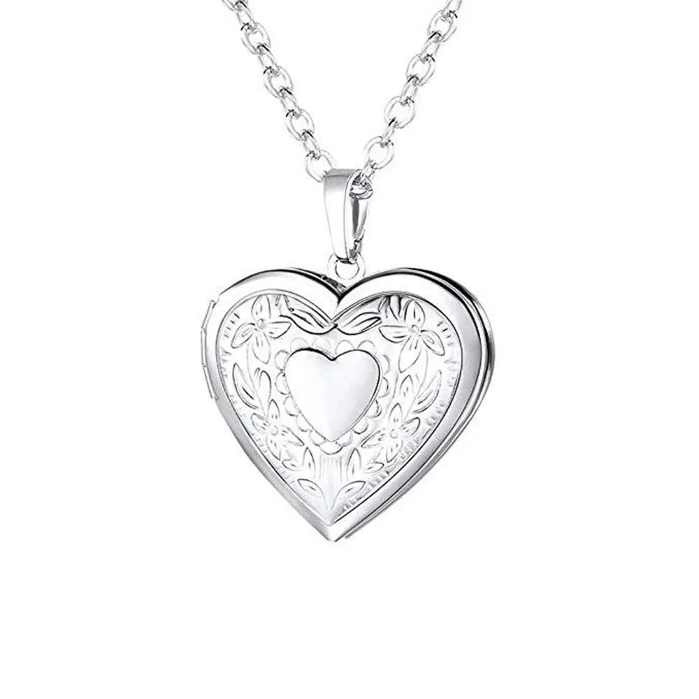 Silver heart-shaped pendant necklace on a white background