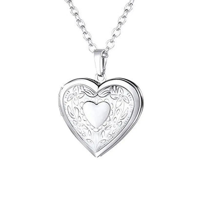 Silver heart-shaped pendant necklace on a white background