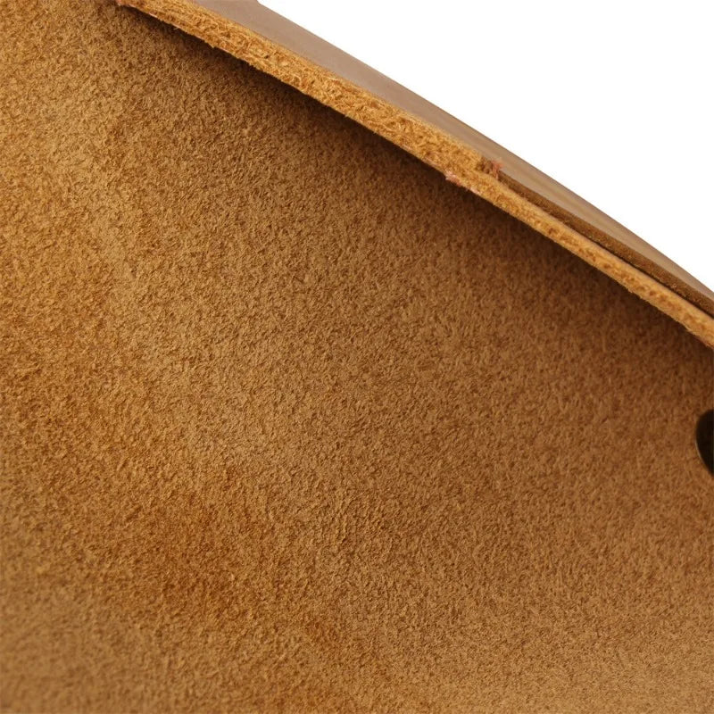 Close-up of brown leather surface with visible texture