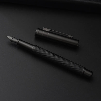 Black fountain pen and cap on a black background