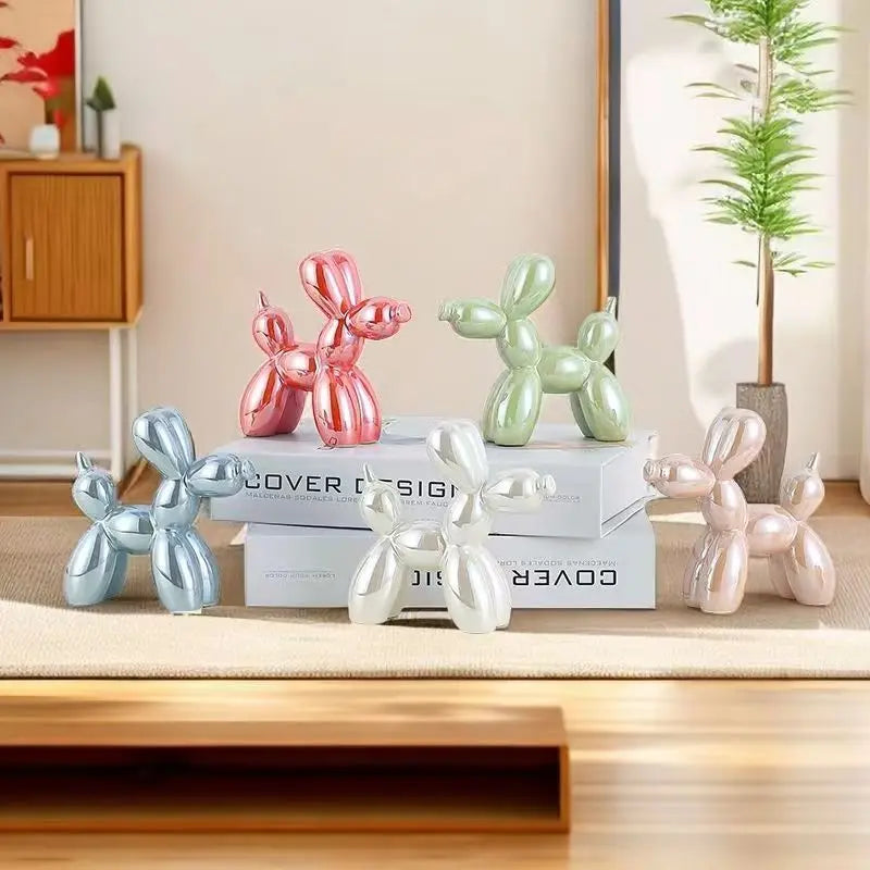 Decorative balloon dog sculptures in various colors on a shelf.