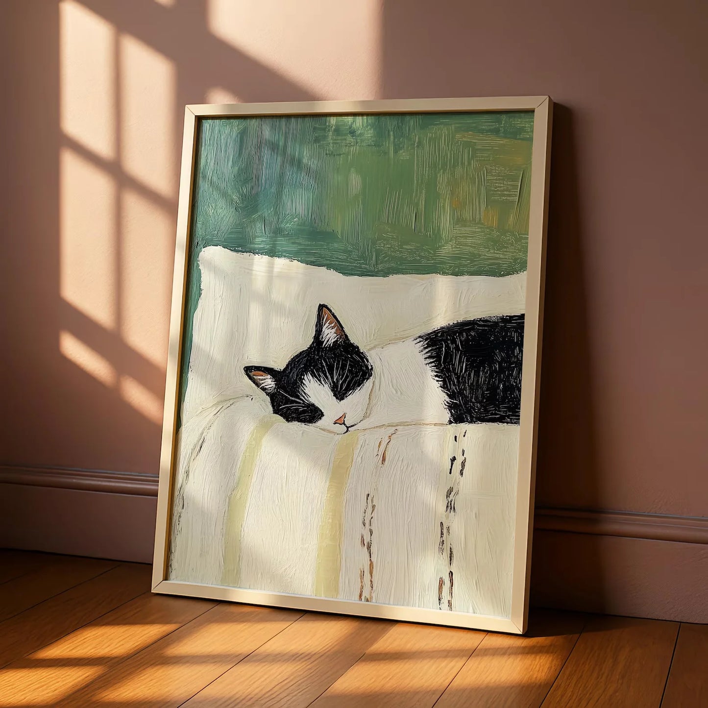 Framed painting of a black and white cat on a wall with sunlight casting shadows.