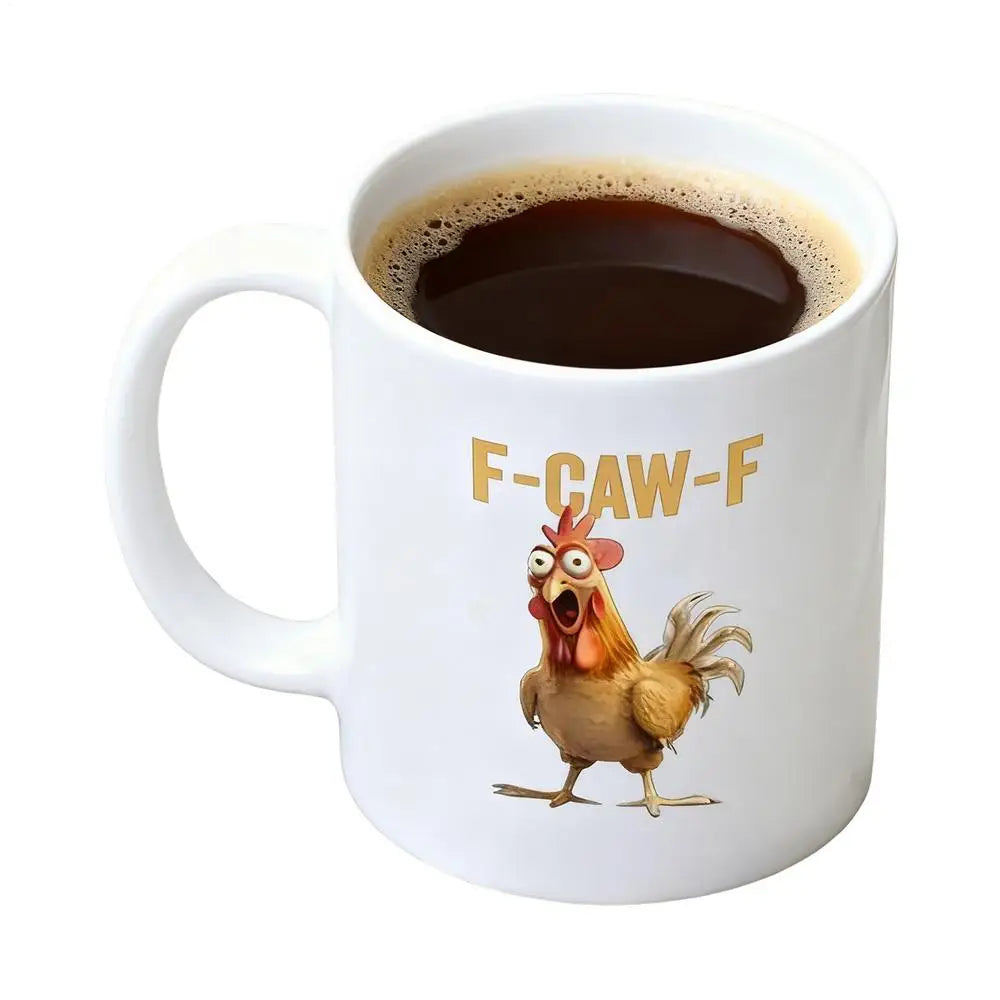 White mug with a cartoon rooster and 'F-CAW-F' text, filled with coffee.