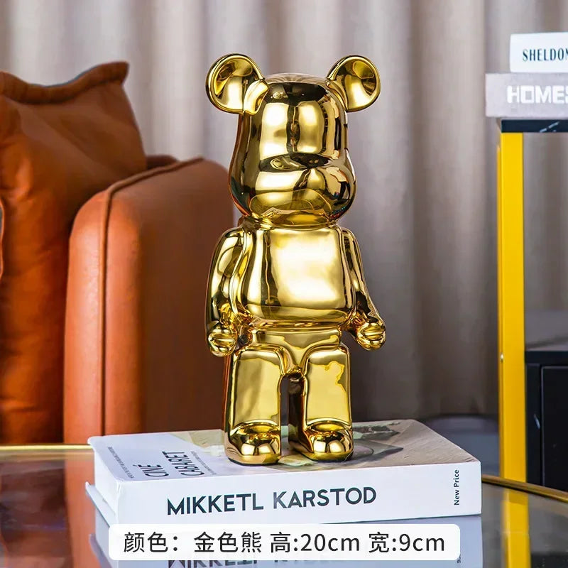 Gold teddy bear figurine on books with a blurred background