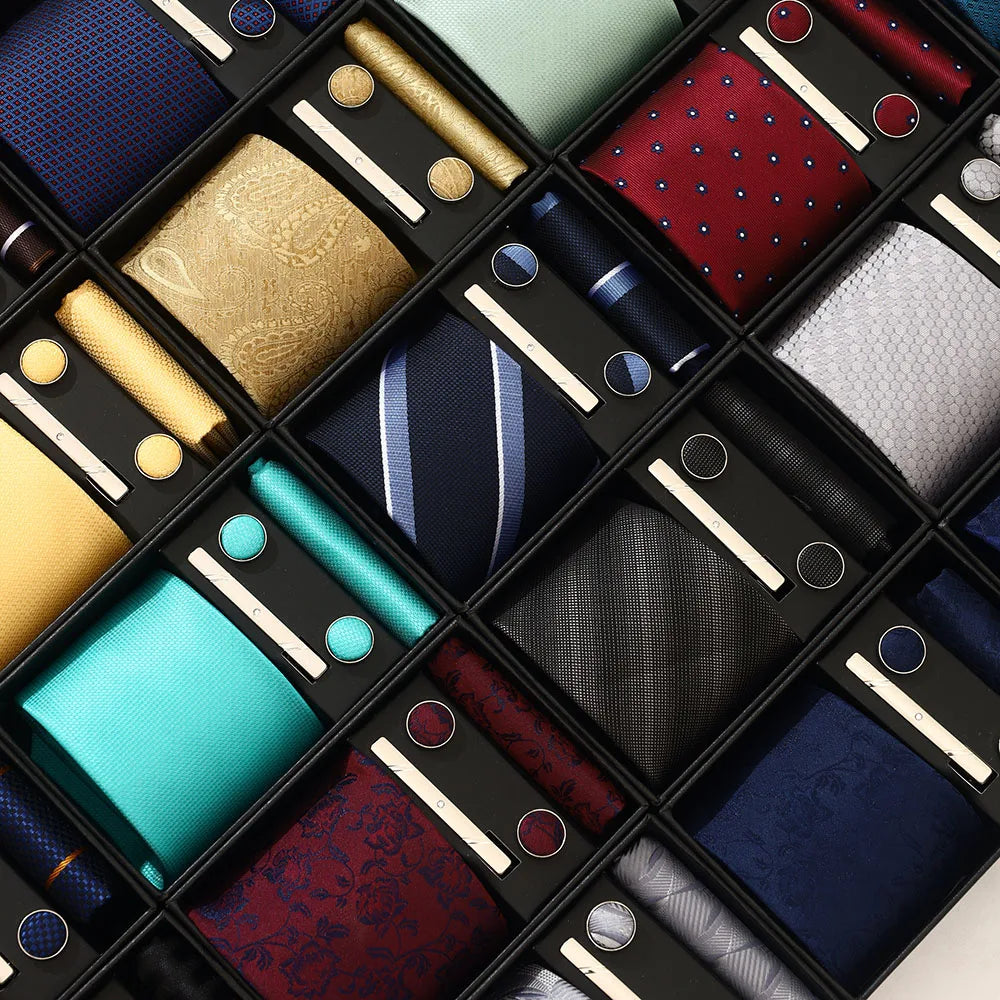 Collection of various ties and pocket squares in a grid layout.