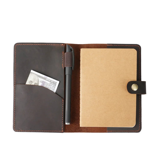 Brown leather wallet with open compartments on a white background