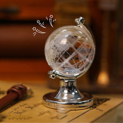 Decorative globe on a stand with a blurred background