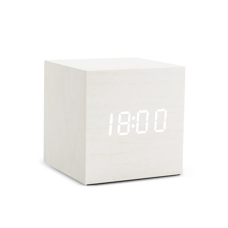 White digital clock with LED display on a white background