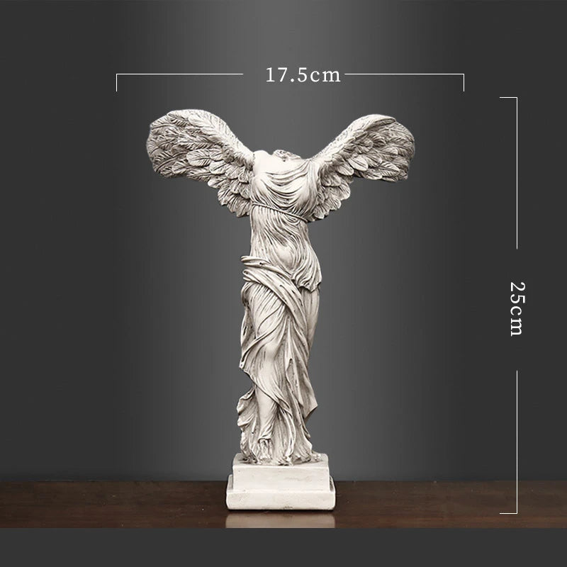 Statue of a winged figure with dimensions on a dark background