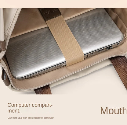 Laptop in a beige bag with text indicating computer compartment capacity.
