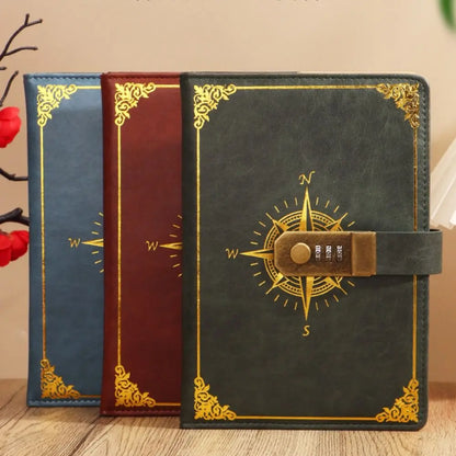 Three leather-bound books with compass designs on a wooden surface.