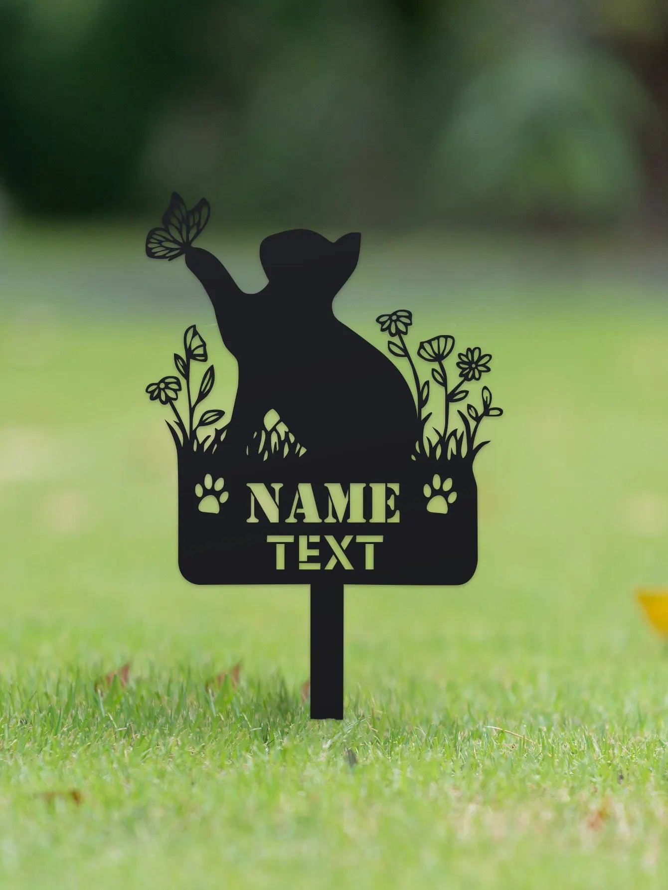 Black silhouette of a dog with flowers and text placeholder on a grassy background