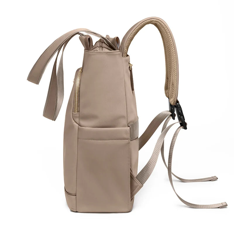 Beige backpack with multiple straps on a white background