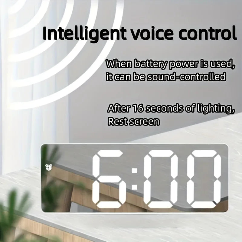 Digital clock with digital display showing time '6:00' on a light background.